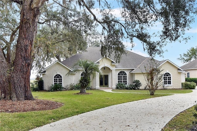 ranch-style home with a front yard