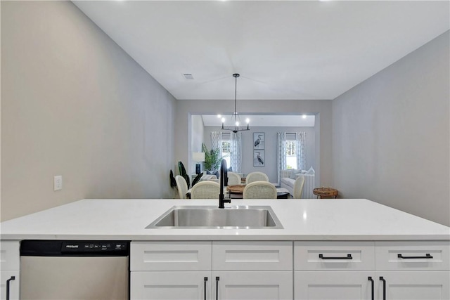 kitchen featuring dishwasher, white cabinetry, and sink