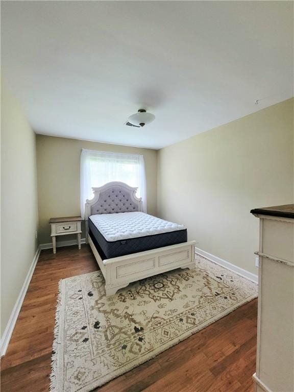 903 Atlantic Ave, Waycross, GA 31501 - bedroom with wood finished floors and baseboards