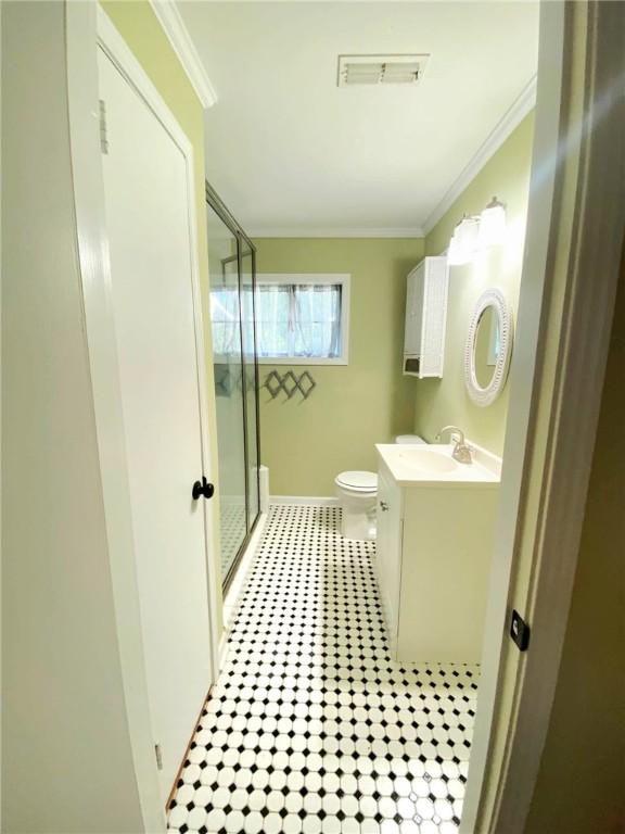903 Atlantic Ave, Waycross, GA 31501 - bathroom with vanity, a stall shower, and crown molding