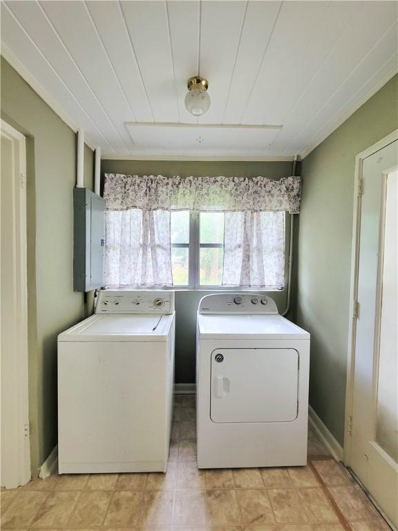 903 Atlantic Ave, Waycross, GA 31501 - laundry room with electric panel, washer and dryer, and light tile patterned floors