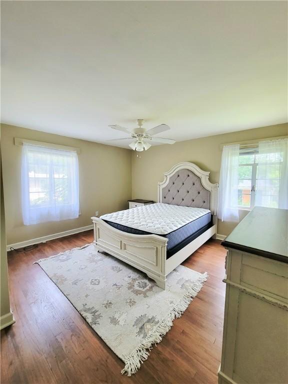 903 Atlantic Ave, Waycross, GA 31501 - bedroom featuring dark wood-type flooring and ceiling fan