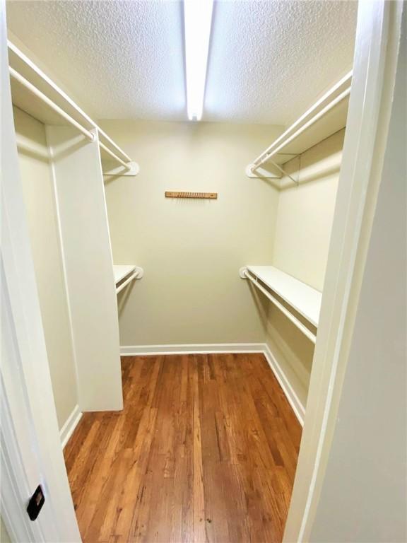 903 Atlantic Ave, Waycross, GA 31501 - walk in closet featuring wood finished floors