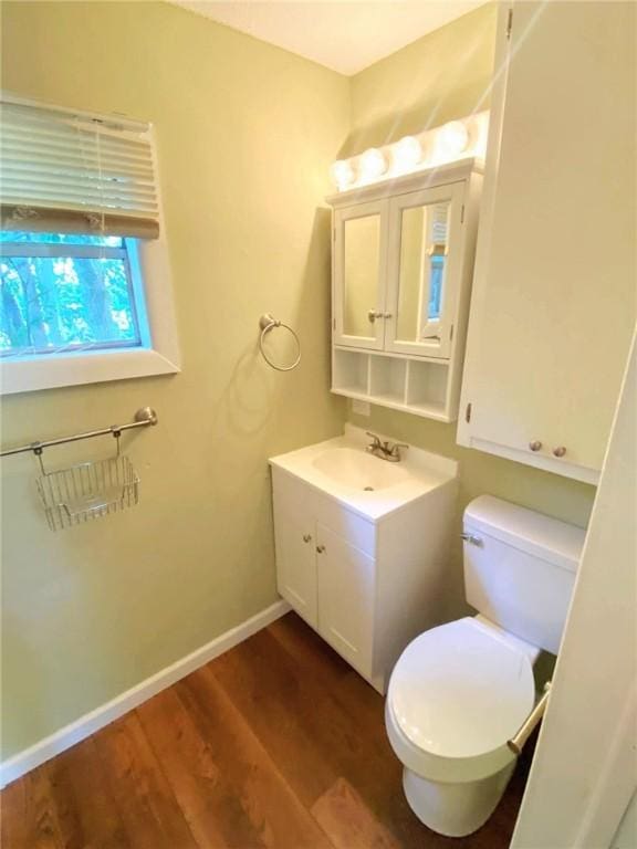 903 Atlantic Ave, Waycross, GA 31501 - half bath featuring vanity and wood finished floors
