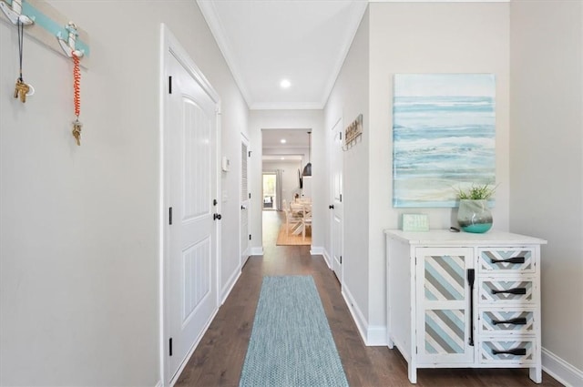 404 Mariners Cir, Saint Simons Island, GA 31522 - hall featuring dark wood-style flooring, crown molding, recessed lighting, and baseboards