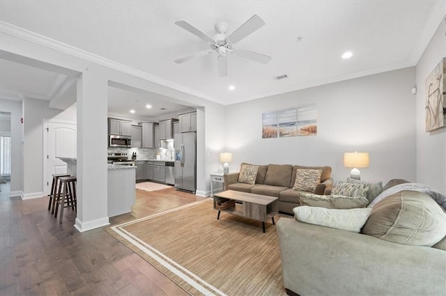 404 Mariners Cir, Saint Simons Island, GA 31522 - living area with a ceiling fan, wood finished floors, recessed lighting, baseboards, and ornamental molding