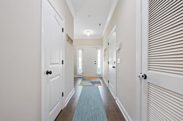 404 Mariners Cir, Saint Simons Island, GA 31522 - doorway with crown molding, dark wood-style floors, and baseboards