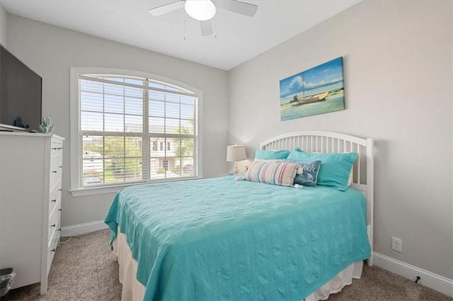 404 Mariners Cir, Saint Simons Island, GA 31522 - carpeted bedroom featuring baseboards and ceiling fan