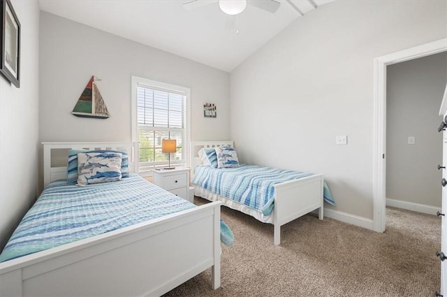404 Mariners Cir, Saint Simons Island, GA 31522 - bedroom featuring lofted ceiling, light carpet, a ceiling fan, and baseboards