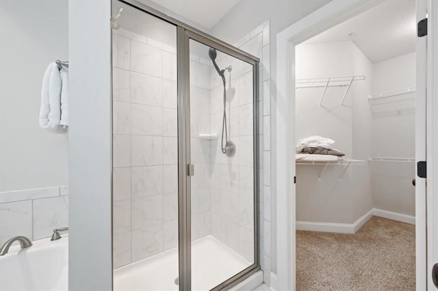 404 Mariners Cir, Saint Simons Island, GA 31522 - bathroom with a garden tub, a shower stall, and a spacious closet