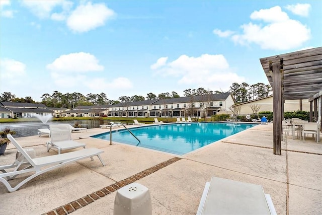 404 Mariners Cir, Saint Simons Island, GA 31522 - community pool featuring a patio, a residential view, and a pergola