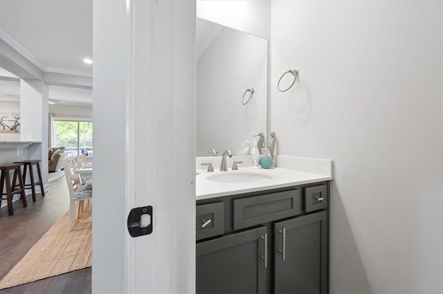 404 Mariners Cir, Saint Simons Island, GA 31522 - bathroom featuring vanity, wood finished floors, crown molding, and recessed lighting
