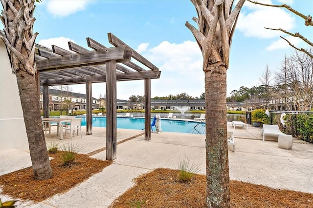 404 Mariners Cir, Saint Simons Island, GA 31522 - community pool featuring a pergola and a patio