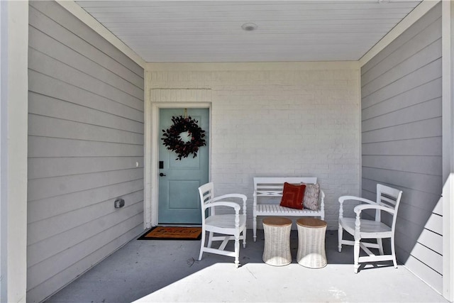 property entrance featuring brick siding