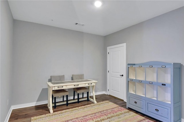 home office featuring dark wood-style floors, visible vents, and baseboards