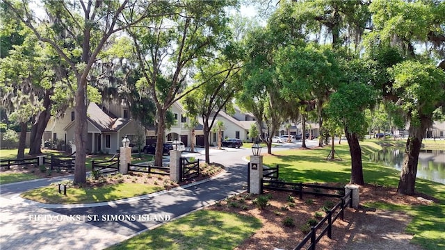 187 Fifty Oaks Ln, Saint Simons Island, GA 31522 - view of property's community featuring a water view, a lawn, and a residential view