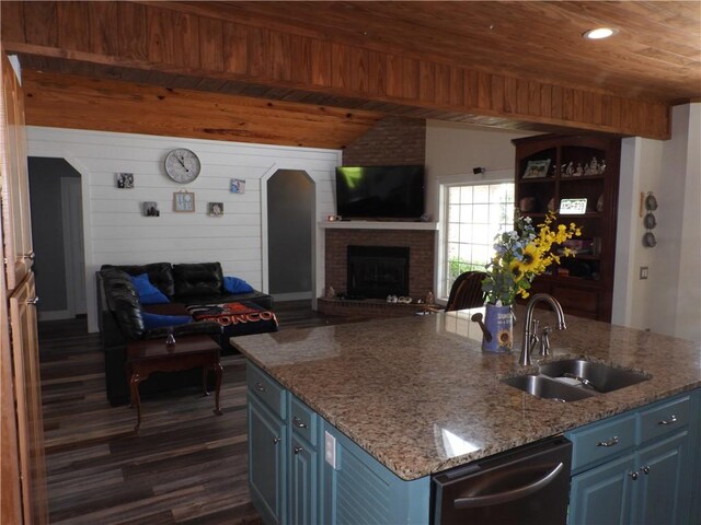 kitchen with blue cabinets, sink, stainless steel dishwasher, dark hardwood / wood-style floors, and wood ceiling