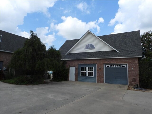 view of side of home featuring a garage