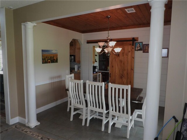 tiled dining space with wooden ceiling and a notable chandelier