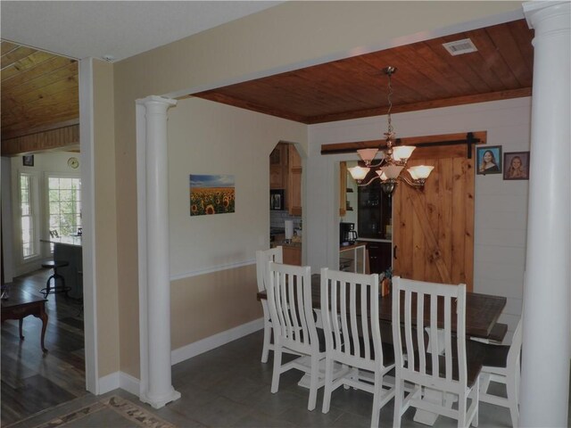 dining space with a chandelier, a barn door, dark wood-type flooring, and wood ceiling