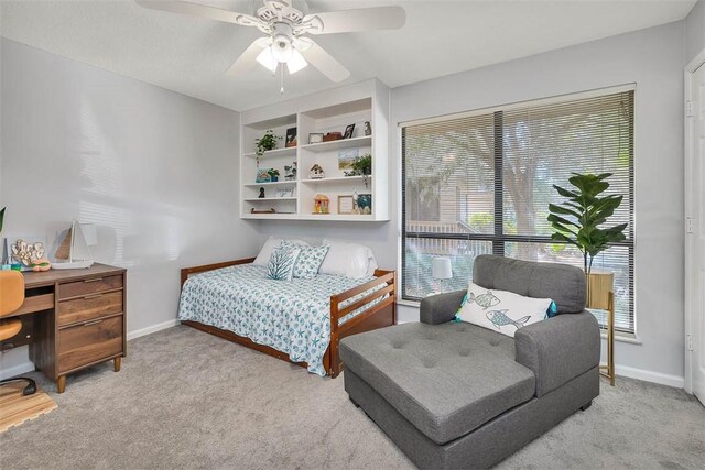 bedroom with light colored carpet and ceiling fan