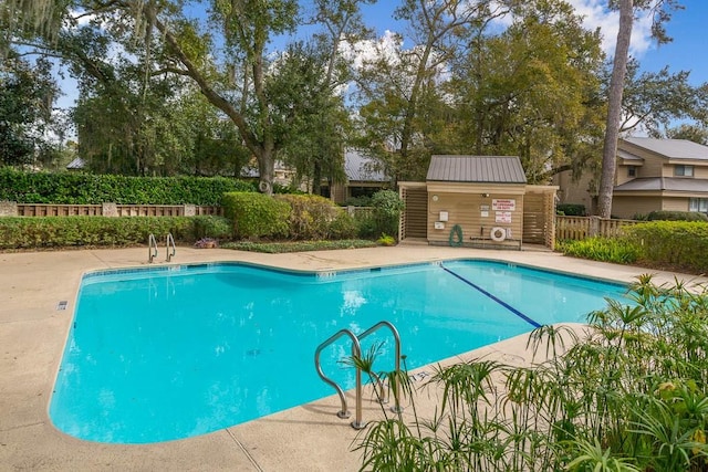 view of swimming pool with a patio