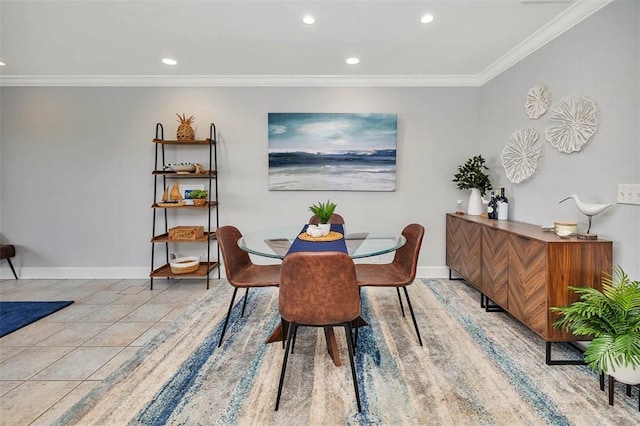 tiled dining room featuring ornamental molding