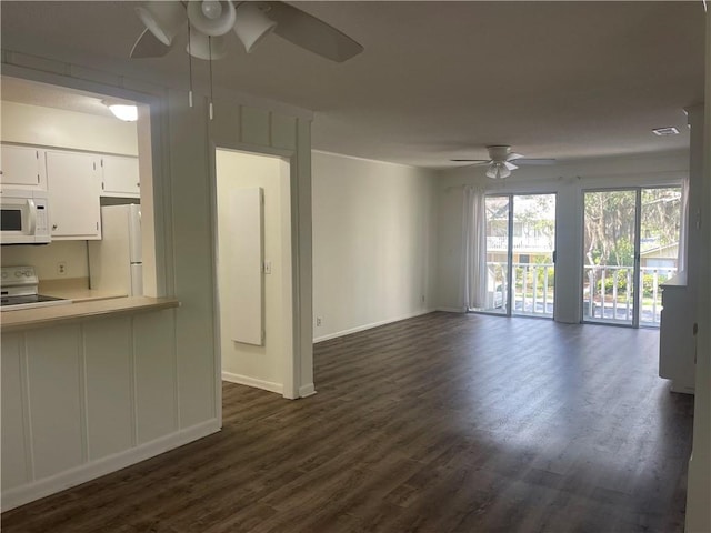 800 Mallery St Unit C-30, Saint Simons Island, GA 31522 - unfurnished living room with ceiling fan, dark wood finished floors, and baseboards