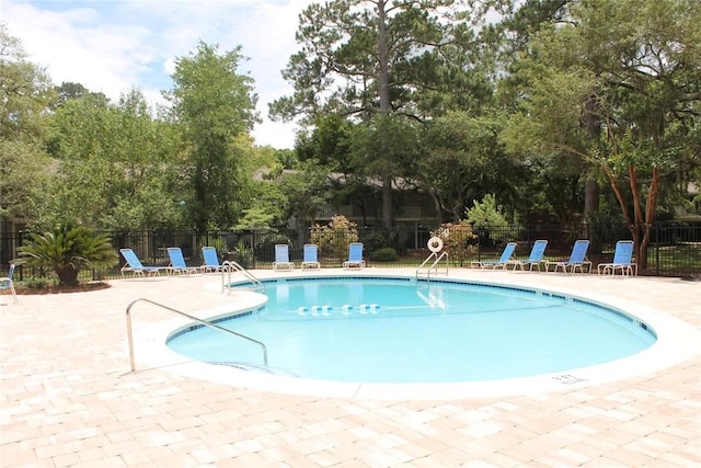 800 Mallery St Unit C-30, Saint Simons Island, GA 31522 - community pool featuring a patio and view of wooded area