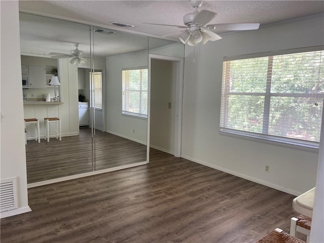 800 Mallery St Unit C-30, Saint Simons Island, GA 31522 - unfurnished living room with ceiling fan, plenty of natural light, a textured ceiling, and wood finished floors
