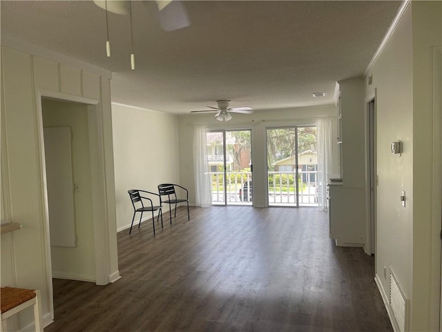 800 Mallery St Unit C-30, Saint Simons Island, GA 31522 - living area featuring ceiling fan and dark wood-style flooring