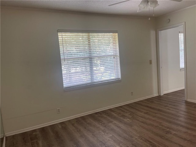 800 Mallery St Unit C-30, Saint Simons Island, GA 31522 - unfurnished room with ornamental molding, dark wood-style flooring, ceiling fan, and baseboards