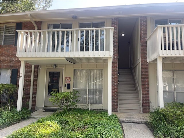 800 Mallery St Unit C-30, Saint Simons Island, GA 31522 - property entrance featuring a balcony and brick siding