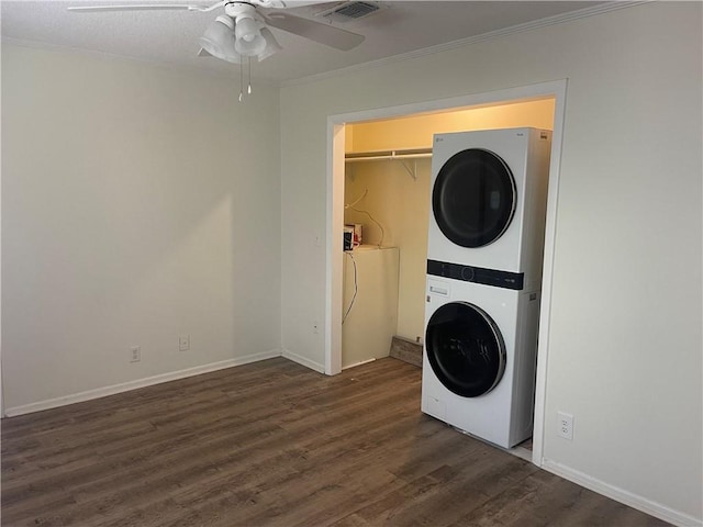 800 Mallery St Unit C-30, Saint Simons Island, GA 31522 - washroom featuring stacked washer / dryer, ornamental molding, wood finished floors, a ceiling fan, and baseboards