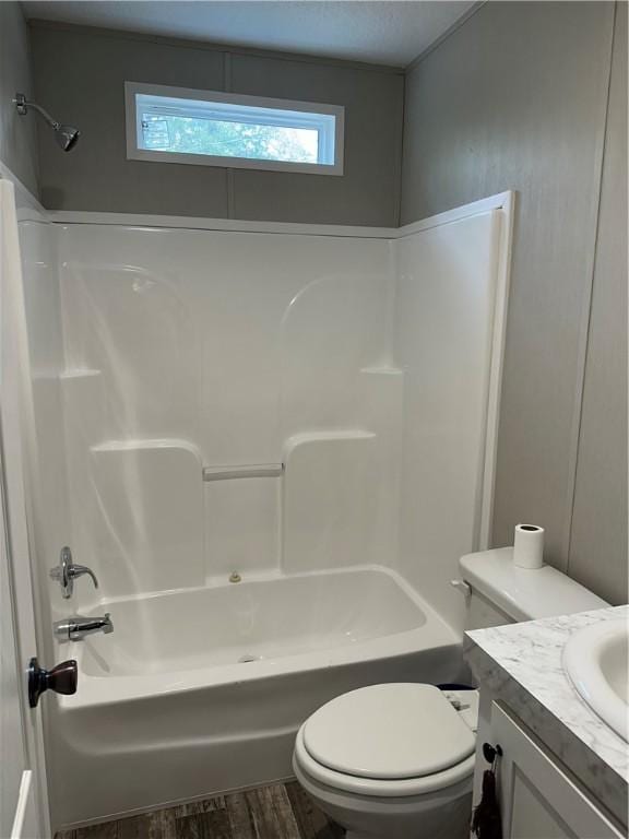 full bathroom with toilet, bathing tub / shower combination, vanity, and wood-type flooring