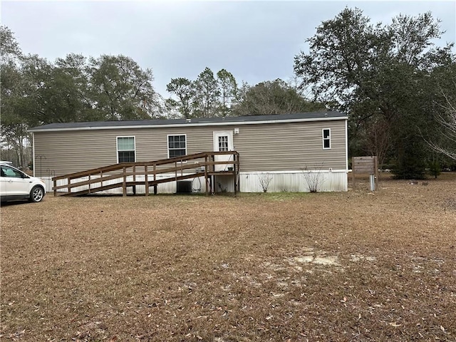 back of house with a wooden deck