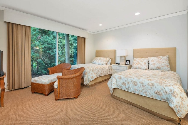 carpeted bedroom with ornamental molding