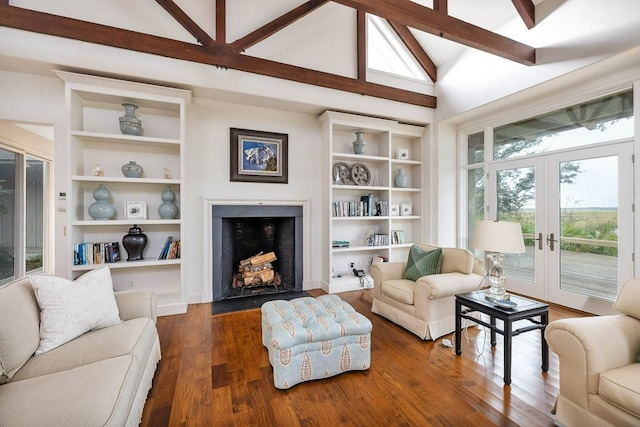 living room with french doors, built in shelves, high vaulted ceiling, dark hardwood / wood-style floors, and beamed ceiling