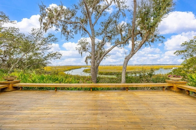 wooden terrace with a water view