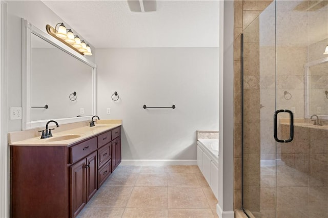 bathroom featuring tile patterned flooring, vanity, a textured ceiling, and shower with separate bathtub