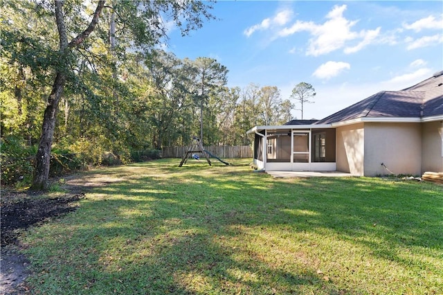 view of yard featuring a sunroom