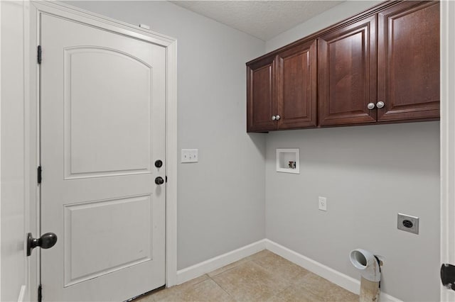 laundry room featuring cabinets, washer hookup, light tile patterned floors, a textured ceiling, and hookup for an electric dryer