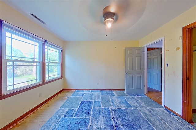 1206 Morningside Dr, Waycross, GA 31501 - unfurnished bedroom with baseboards and a ceiling fan