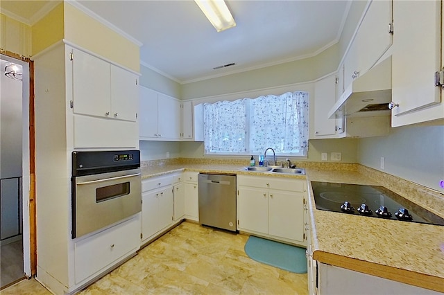 1206 Morningside Dr, Waycross, GA 31501 - kitchen featuring appliances with stainless steel finishes, ornamental molding, under cabinet range hood, light countertops, and white cabinetry