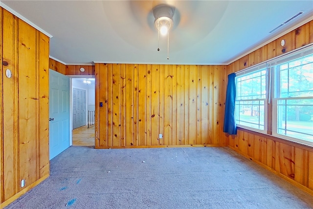 1206 Morningside Dr, Waycross, GA 31501 - unfurnished room with ceiling fan, carpet, wooden walls, and crown molding