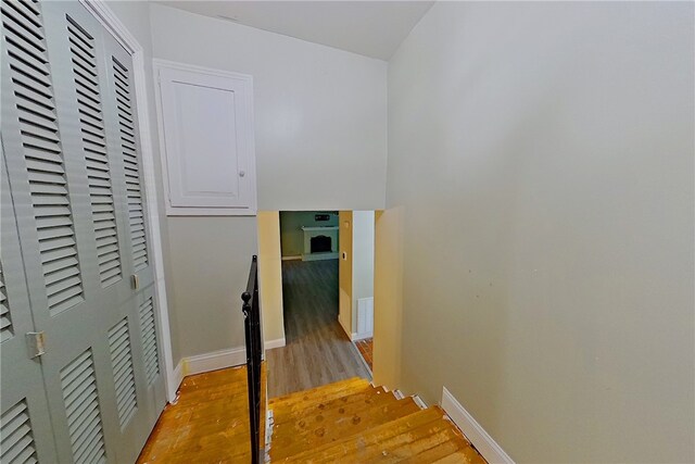 1206 Morningside Dr, Waycross, GA 31501 - corridor featuring light wood-style floors and an upstairs landing