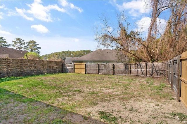 view of yard featuring a fenced backyard