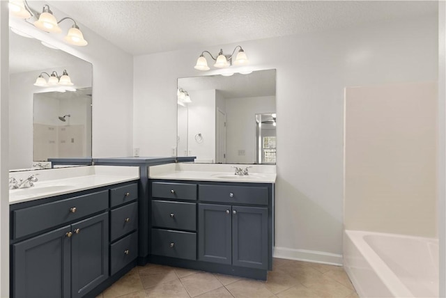 full bathroom featuring tile patterned floors, two vanities, a sink, a textured ceiling, and a shower