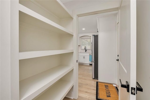 155 Mcdowell Ave, Brunswick, GA 31525 - hall featuring a sink, light wood finished floors, and recessed lighting