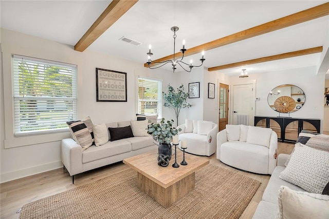 155 Mcdowell Ave, Brunswick, GA 31525 - living area with beamed ceiling, baseboards, a chandelier, and light wood finished floors